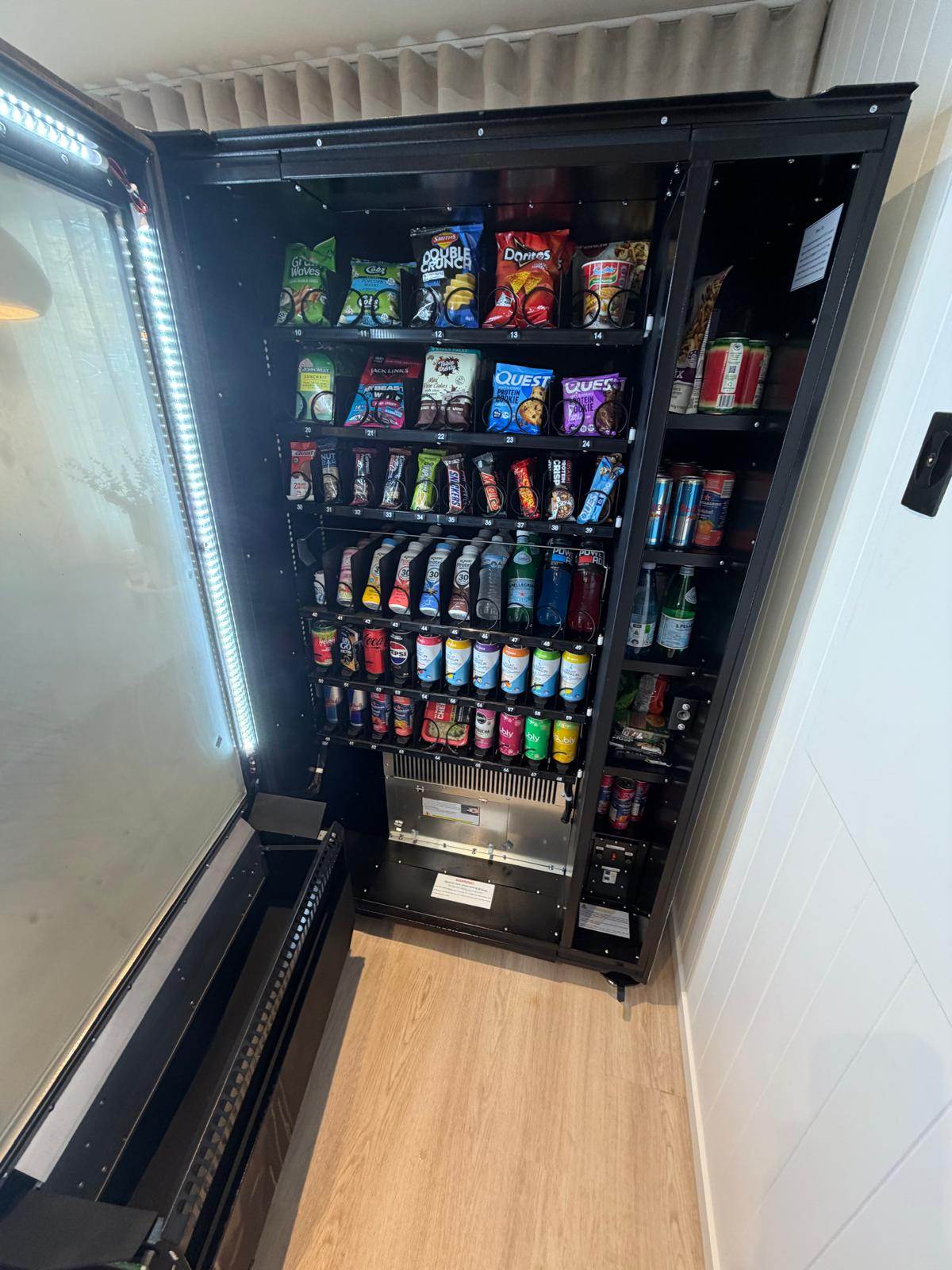 AP Vending machine interior — stocked with snacks and drinks